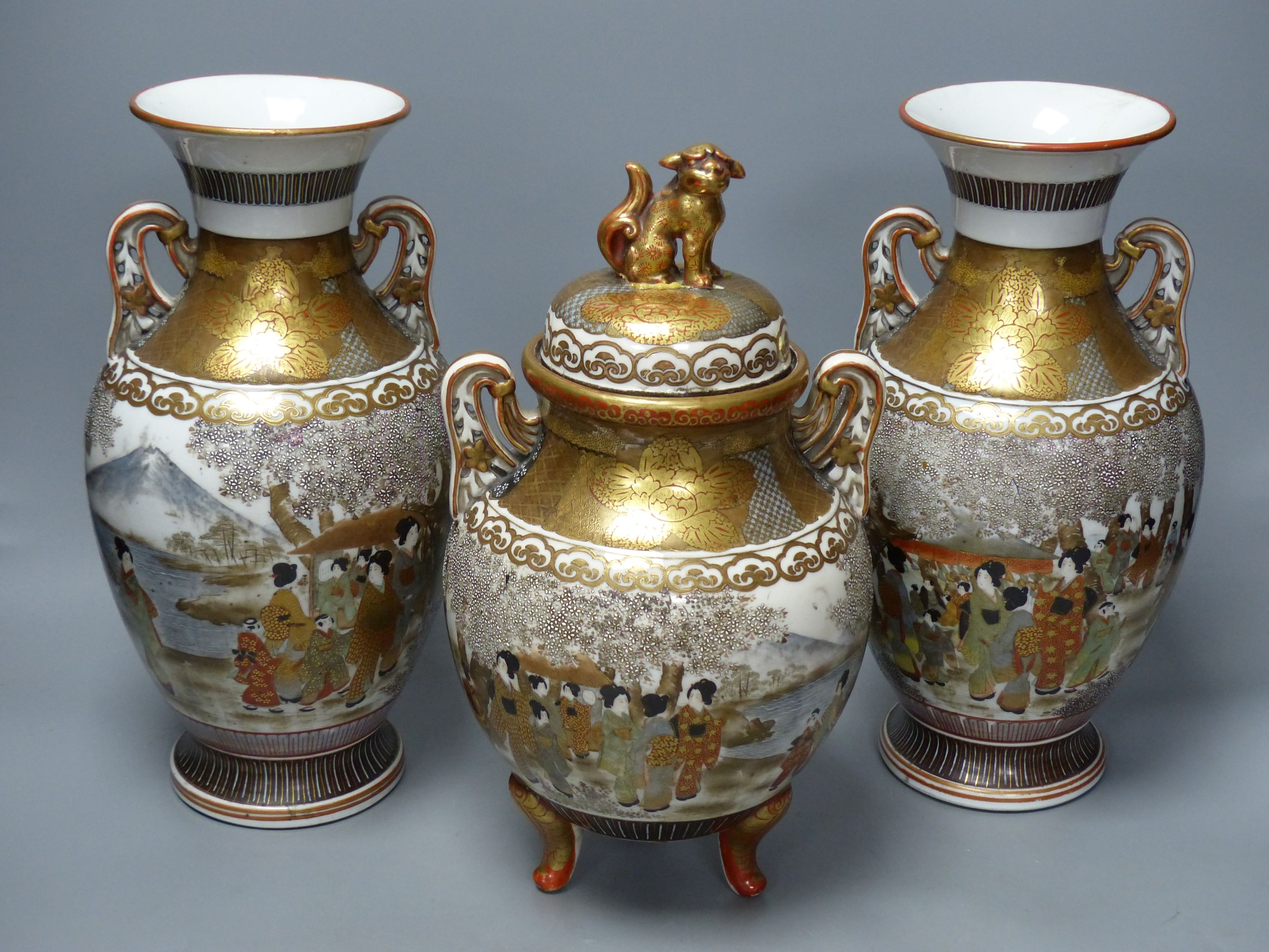 A Japanese Kutani porcelain garniture of two vases and a similar koro and cover, tallest 31cm
